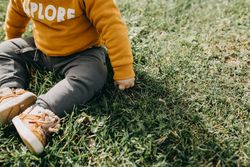 Boy sitting in the grass