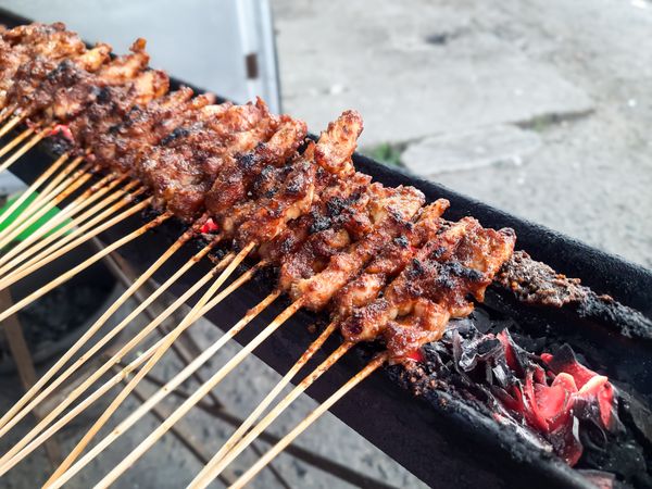 Madura Chicken Satay Being Grilled Over Charcoal