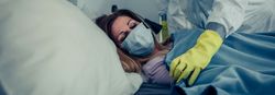 Woman in home quarantine for a virus attended by a doctor