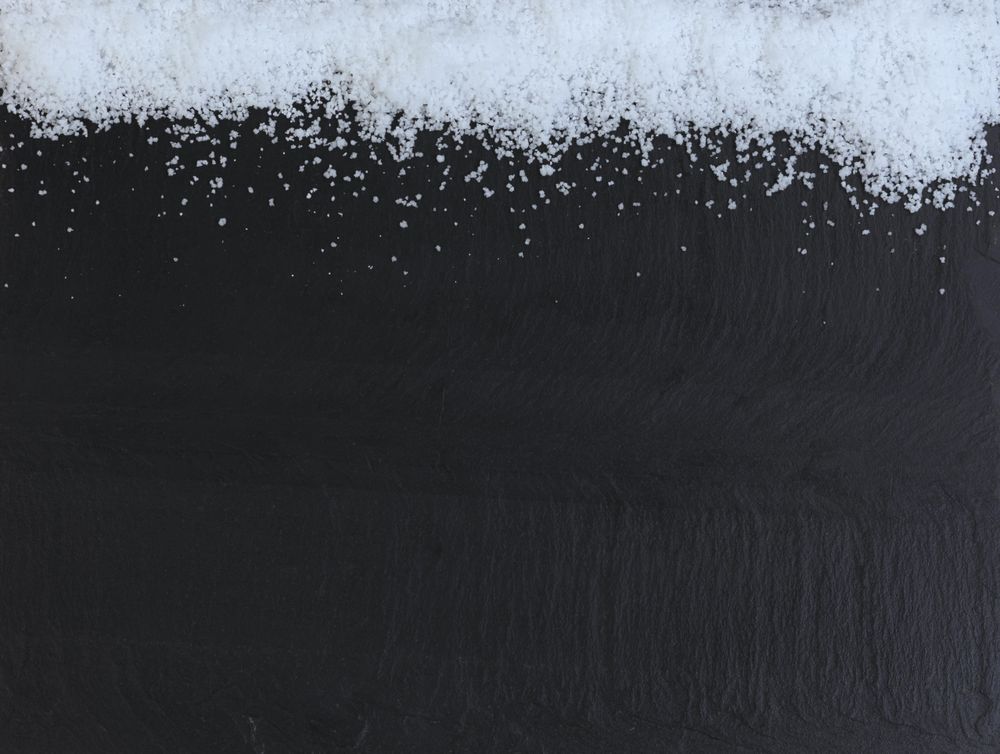 Christmas top border of snow on dark stone