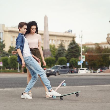 Teenagers on a date with skateboards