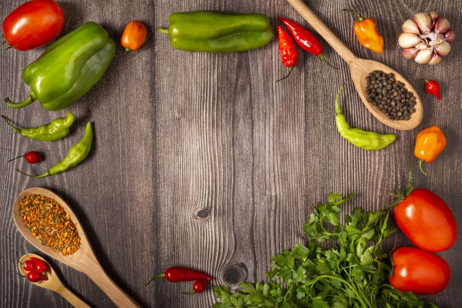 Ingredients for cooking with tomatoes, various peppers, garlic and green peppers.