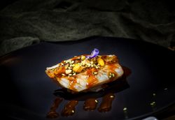 Tasty sushi poured with sauce in sticks