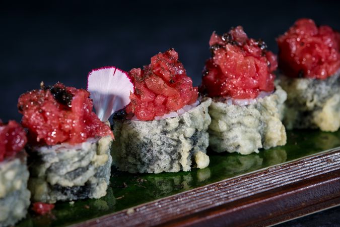 Delicious uramaki sushi rolls with raw tuna
