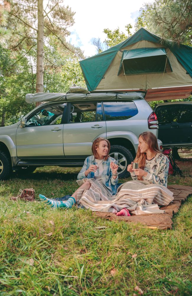 Women sitting under blanket with 4x4 on background