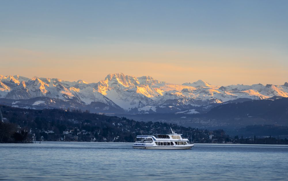 Empty yacht sailing on lake at sunset