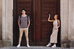 Happy couple having fun while walking in town