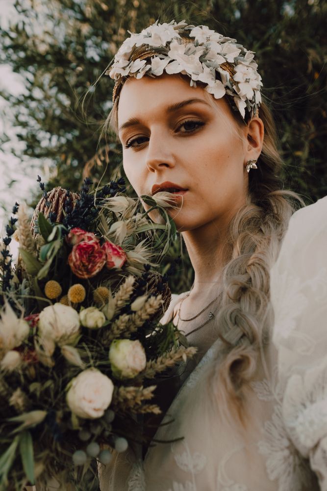 Woman in dress with flower bouquet