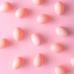 Pink Easter eggs on pink table