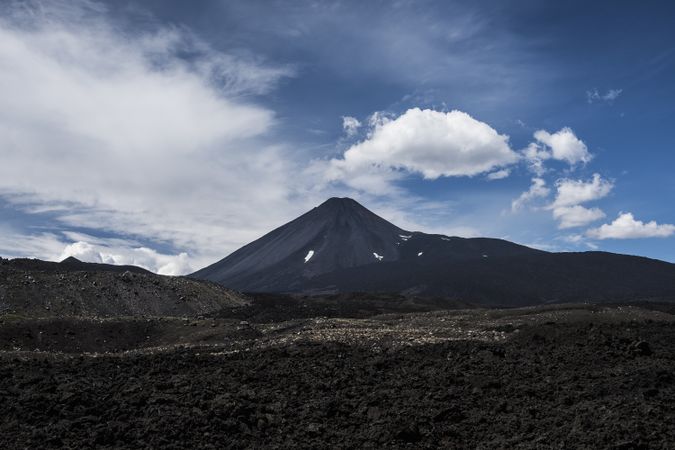 Mountain peak abutting sky in desert valley