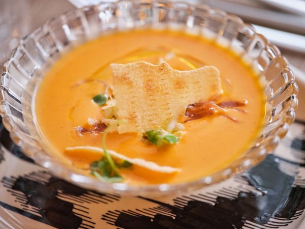 Plate of soup puree on table