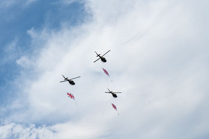 Helicopters fly in the sky of Tbilisi city