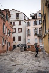 Old buildings and cobblestone road at city street