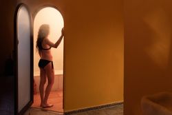 Woman in door of steam room in Arabic spa