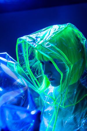 Asian woman posing in fluorescent light