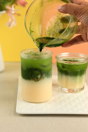 Pouring Matcha to the Milk, Process making Matcha Latte