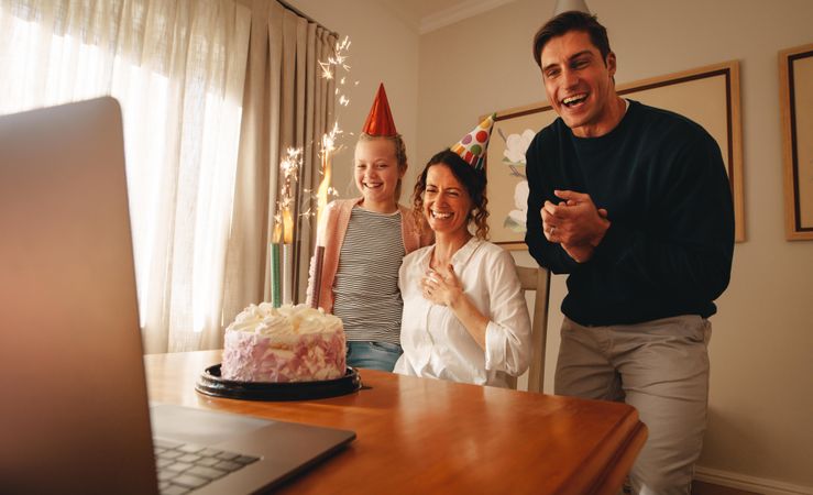 Family celebrating mother's birthday online