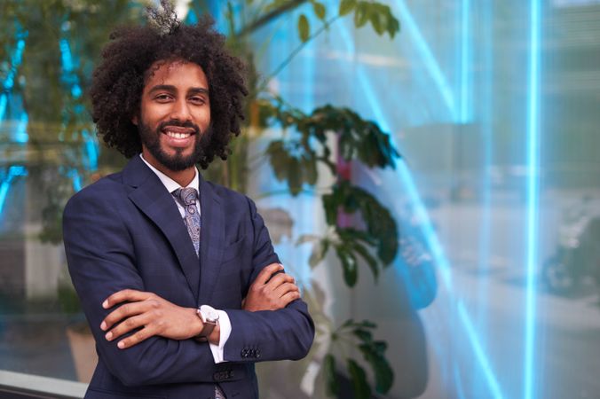 Successful Black businessman in suit smiling