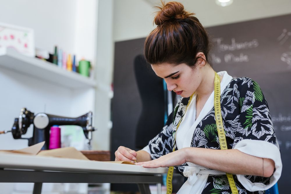 Woman in a sewing school