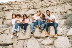 Big multiethnic family travelling together on nature