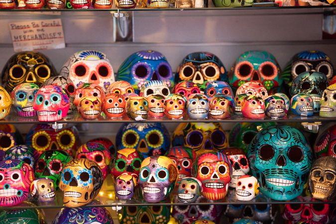 Rows of painted ceramic skulls for sale
