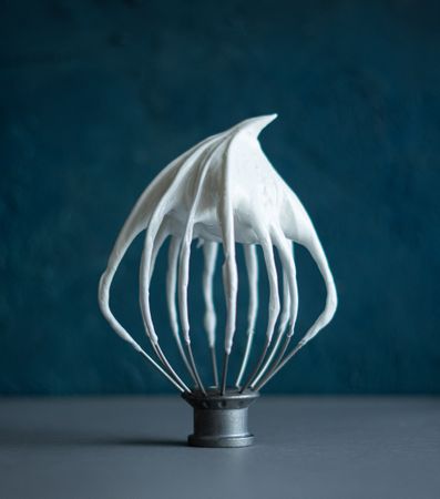 Whisk with buttercream contrast