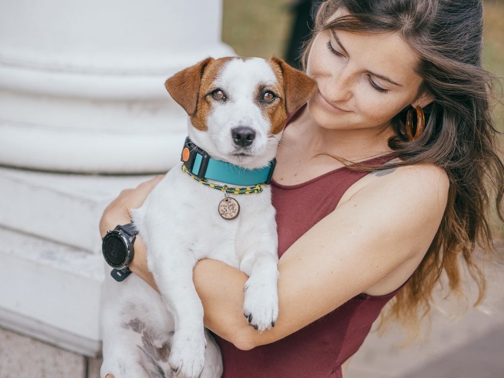 Woman hugging a dog