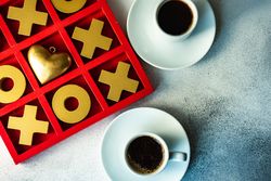 St. Valentine day card concept with game and coffee