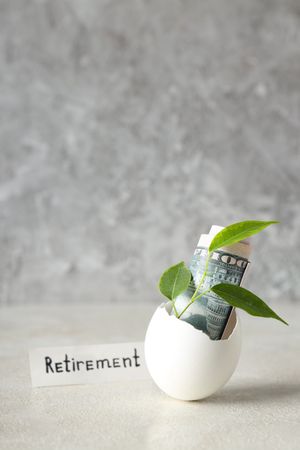 Composition with egg shell and money - retirement