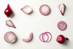 Flat lay composition with red onion on neutral background