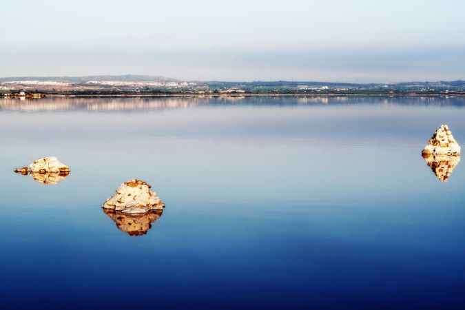 Beautiful lake with rocks in blue water