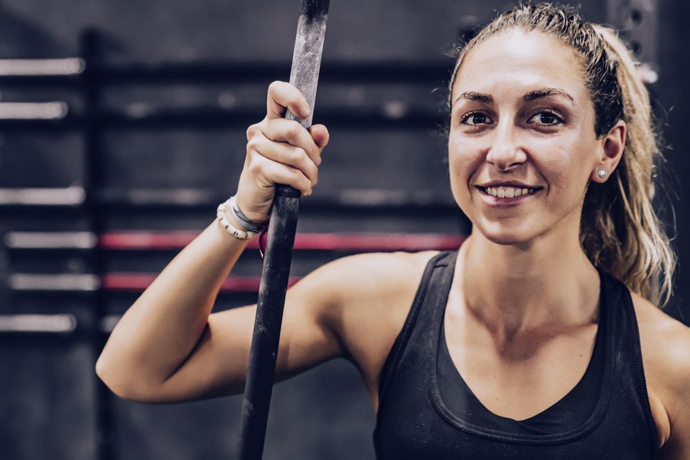 Serene woman relaxing in gym