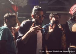 London, England, United Kingdom - Nov 9, 2022: Man wearing sunglasses inside enjoying dance 0WWXy0