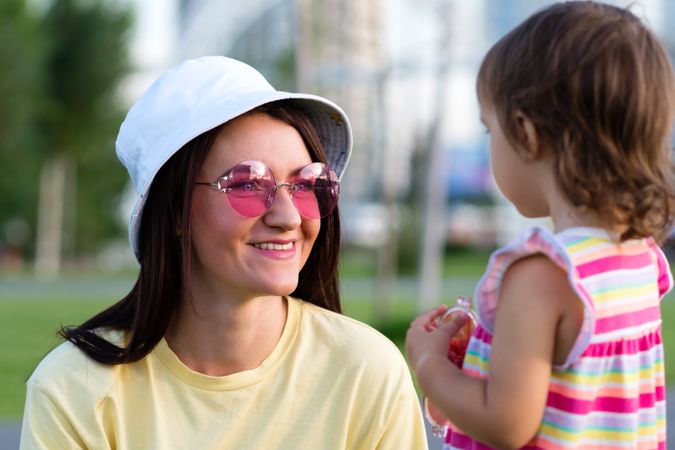 Toddler girl and smiling mom