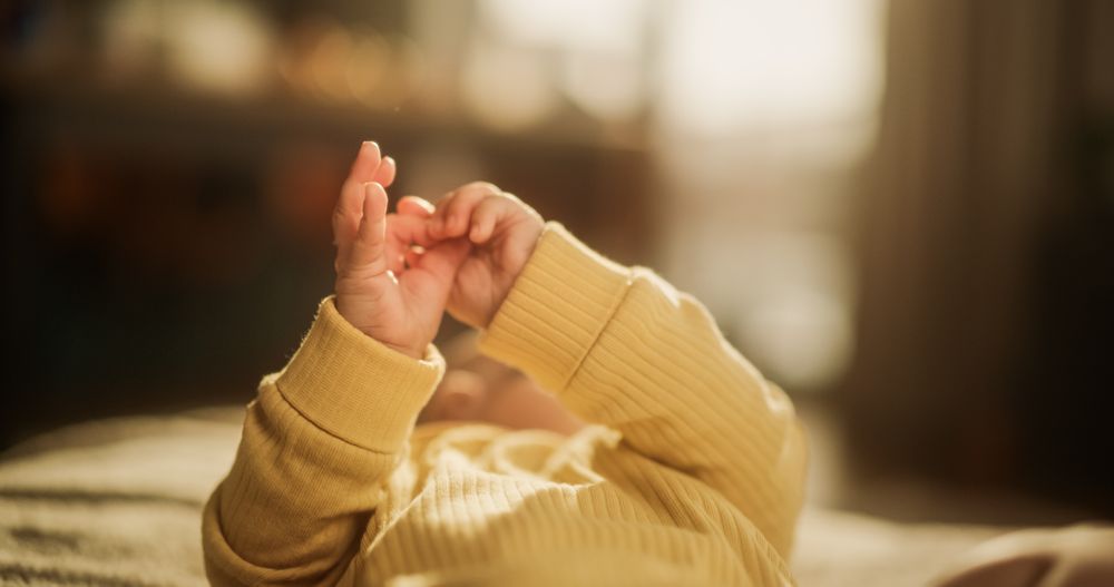 Little Active Toddler Trying to Communicate and Cooing. Little Palms Ready to Discover the New World and Receive Love From The Young Family