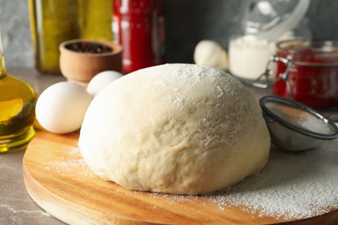 Concept for cooking pizza with ingredients and dough