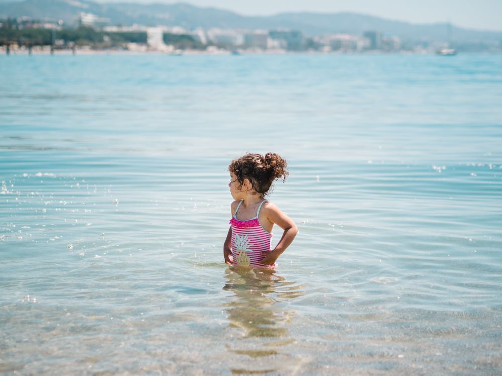 Cheerful bathing in warm sea