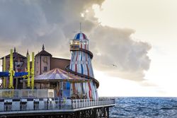 Amusement park on pier in evening