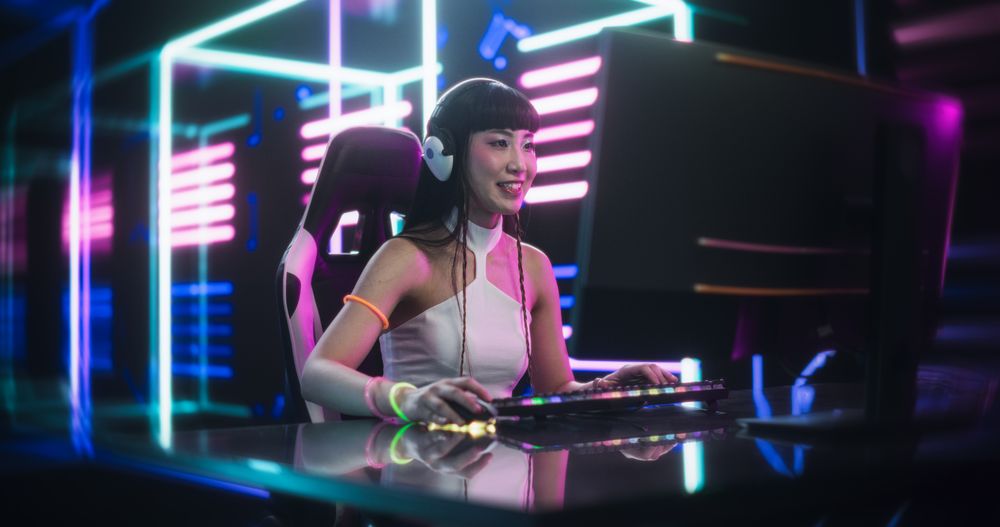 Young Female Gamer Playing Online Video Game on a Computer in a Cyberpunk Digital Neon World.