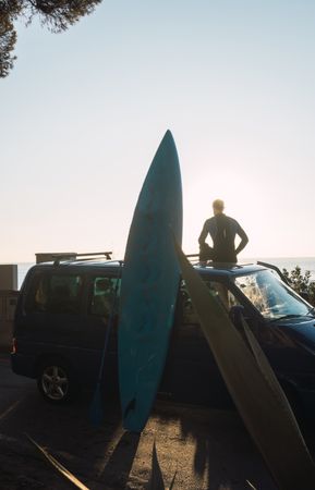 Man enjoying the sunrise in his camped van