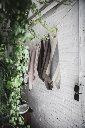 dish cloths hanging on twist with pins