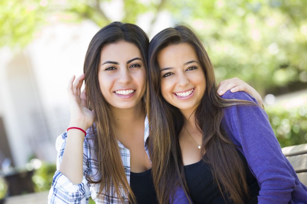 Female Friends Smiling Together Outside