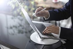 Businessman Working on Laptop at Office Desk