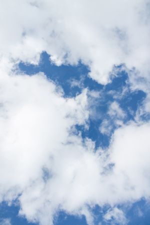 Vertical composition of clouds in blue sky
