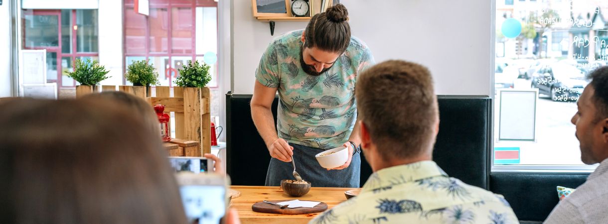 Young cook giving a cooking workshop