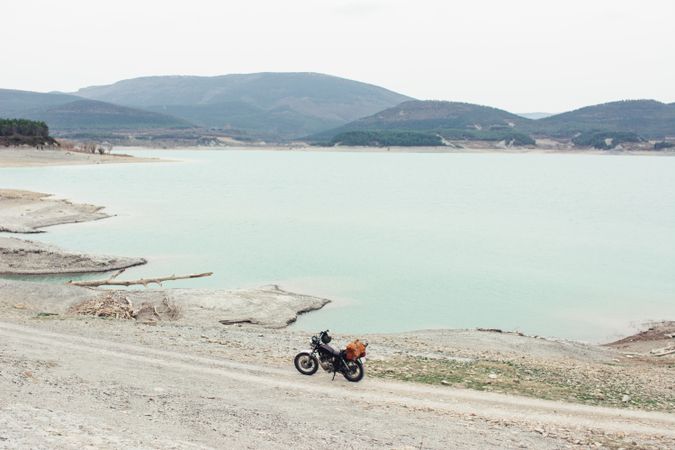 Motorcycle near calm lake