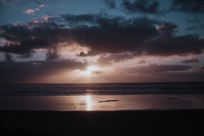 Beautiful sunset over sea with cloudy sky