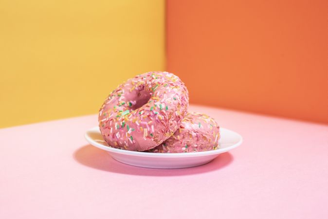 Pink doughnuts in a multicolor background