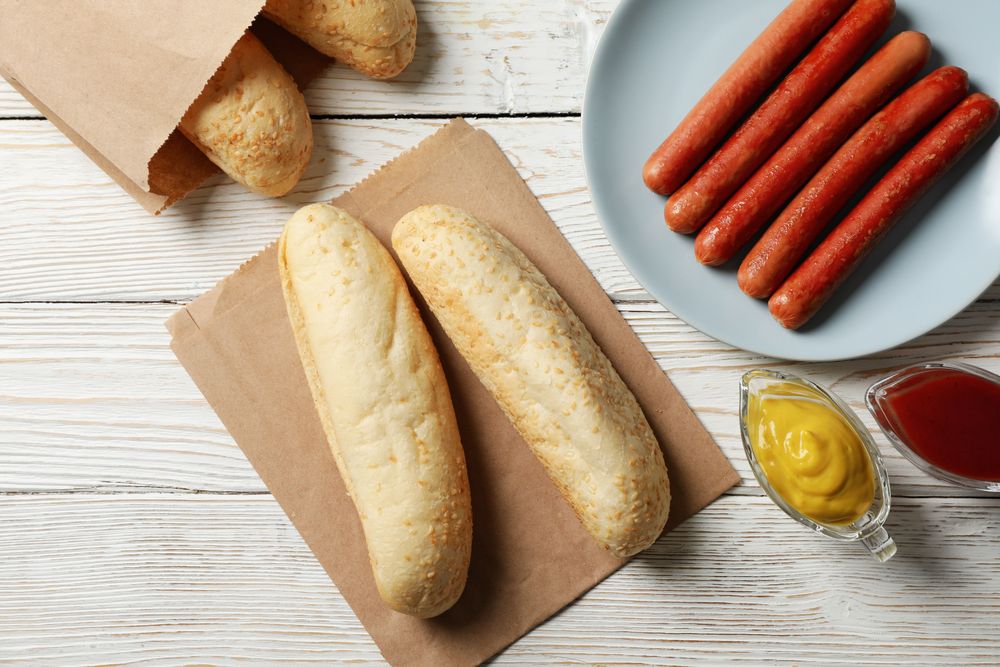 Ingredients for hot dog on plain wooden rustic background