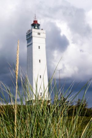 Lighthouse under cloudy sky